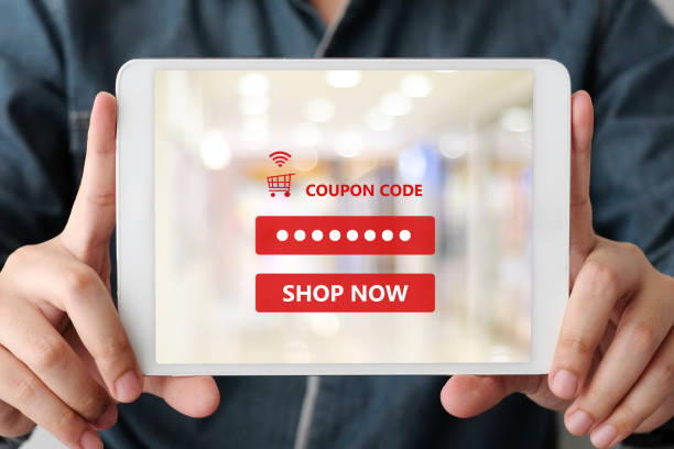 istock Hand holding digital tablet with discount coupon code on screen to get the shopping on line sale promotion, on line shopping ,digital marketing business and technology, lifestyle concept 1070046698