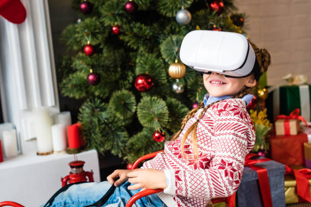 istock cute smiling child sitting in sled and using virtual reality headset at christmas time 1070048898