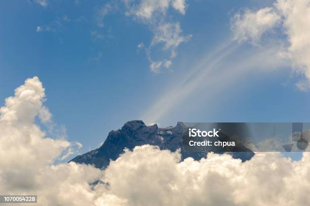 View Of Mt Kota Kinabalu Surrounded With Clouds Stock Photo - Download Image Now - Adventure, Asia, Climbing