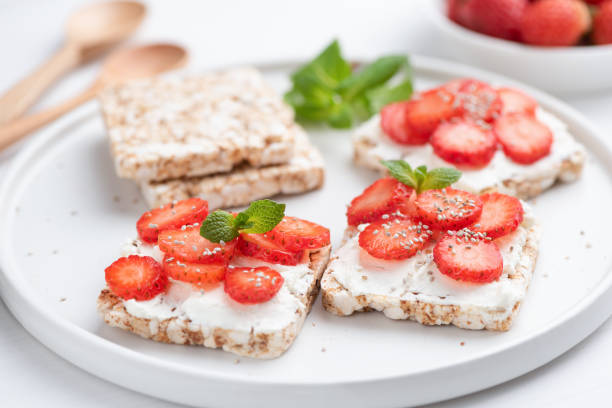 istock Healthy rice crispbread snack with curd cheese and strawberries 1070056512