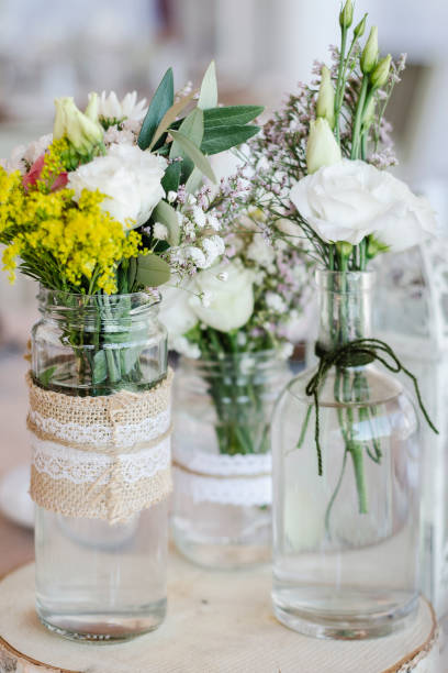 istock flowers arrangement and decoration rustic interior design in wedding table detail 1070056780