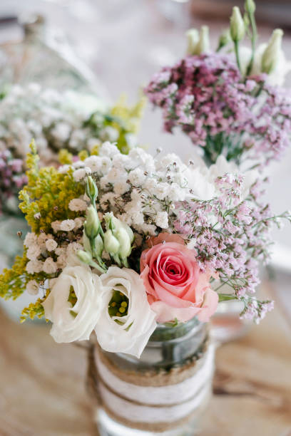 istock flowers arrangement and decoration rustic interior design in wedding table detail 1070056782