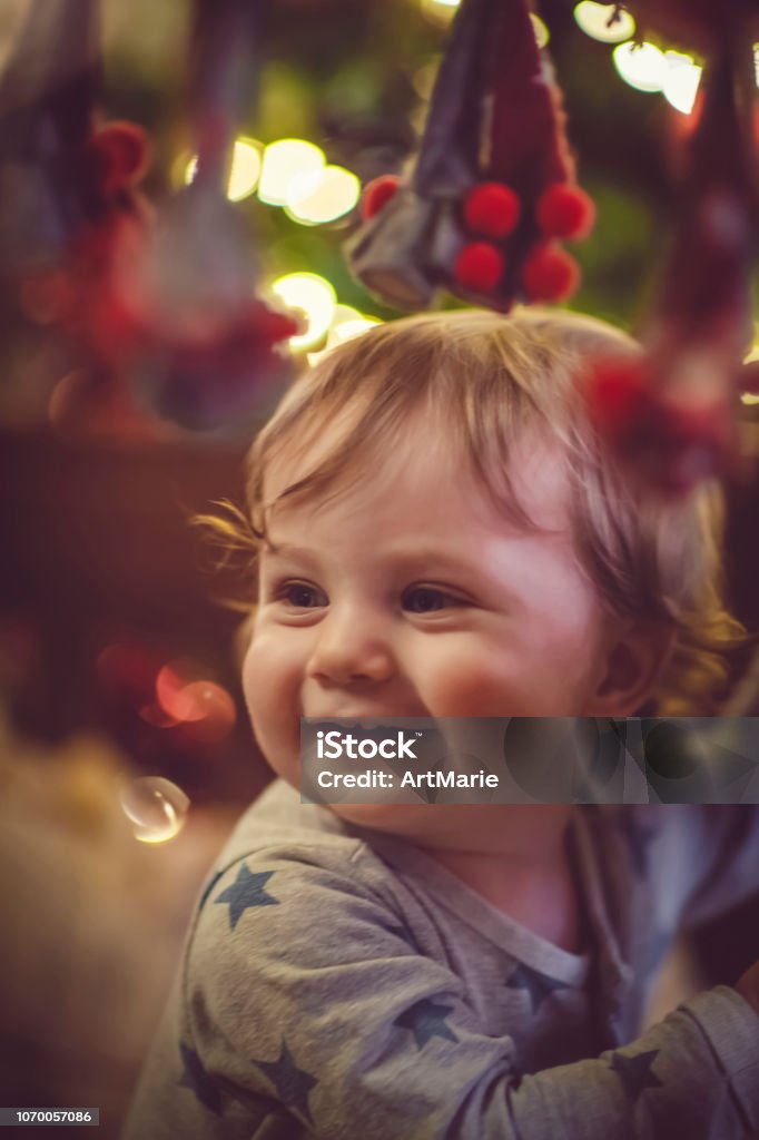 Cute boy in crib in Christmas Child in bed in Christmas Eve Baby - Human Age Stock Photo