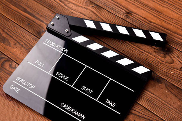 istock Movie clapper board on wooden background 1070057502