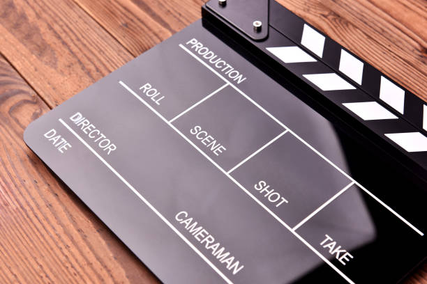 istock Movie clapper board on wooden background 1070057508
