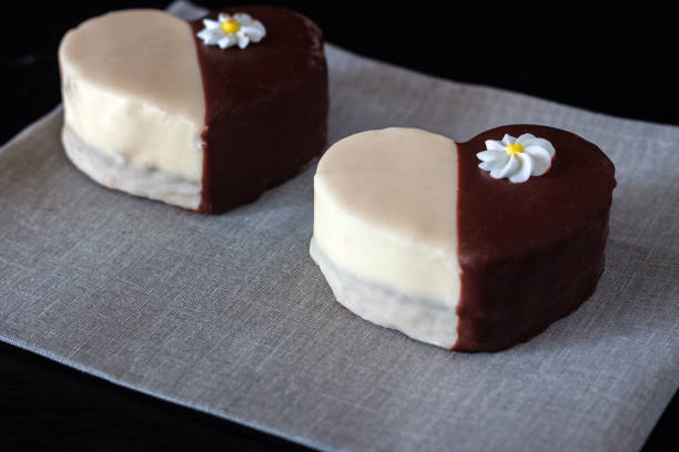 Chocolate covered biscuit heart shaped biscuit on a napkin
