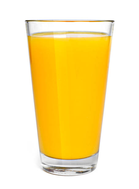 succo d'arancia fresco in un bicchiere da bere - gourmet fruit orange isolated on white foto e immagini stock
