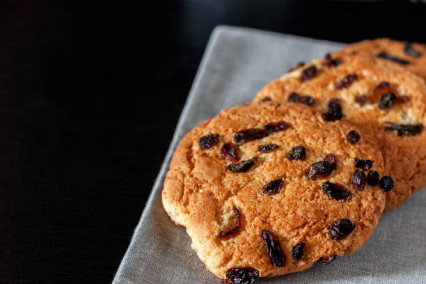 istock Shortbread cookies with raisins for tea lying on the table 1070062174