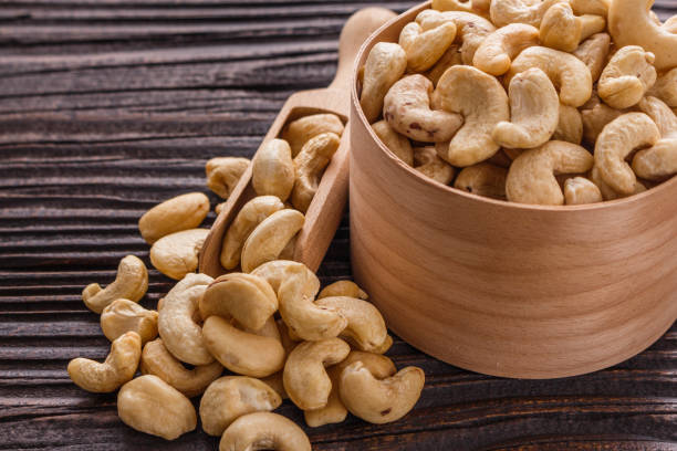 istock cashew nuts on a rustic wooden background 1070063242