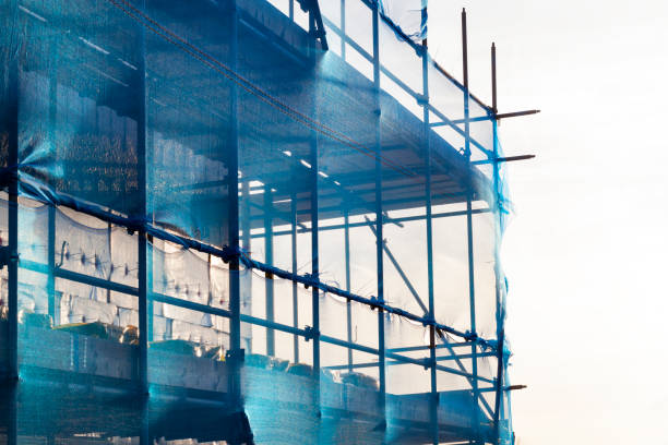 istock Blue scaffolding with safety netting 1070065278