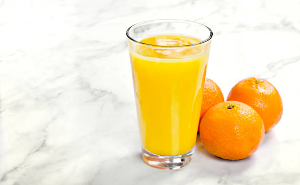 istock Fresh orange juice in a drinking glass 1070066500