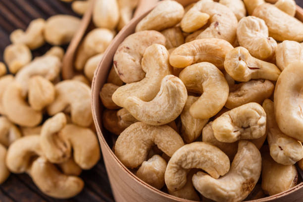 istock cashew nuts on a rustic wooden background 1070067740