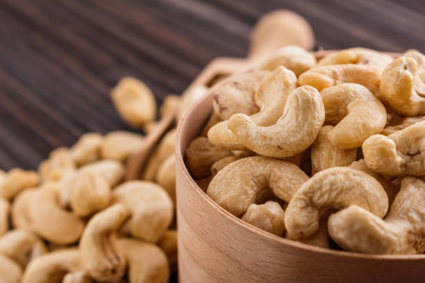 istock cashew nuts on a rustic wooden background 1070067794