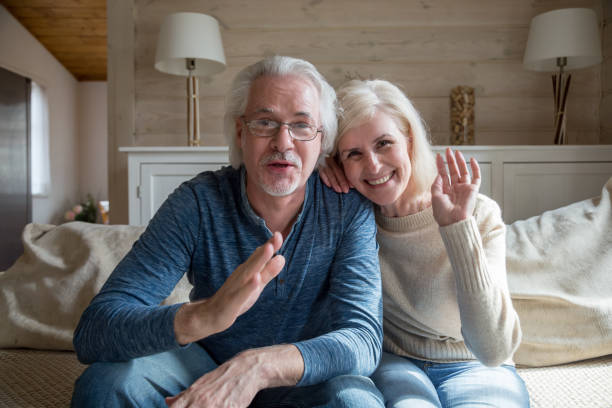 istock Happy senior couple having video call talking from home 1070069368