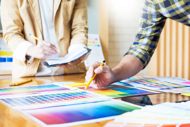 istock Midsection Of Design Professionals With Color Swatches Working On Table 1070072580