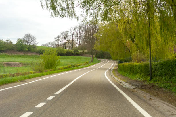 istock Winding road dutch Belgium german border area 1070075978