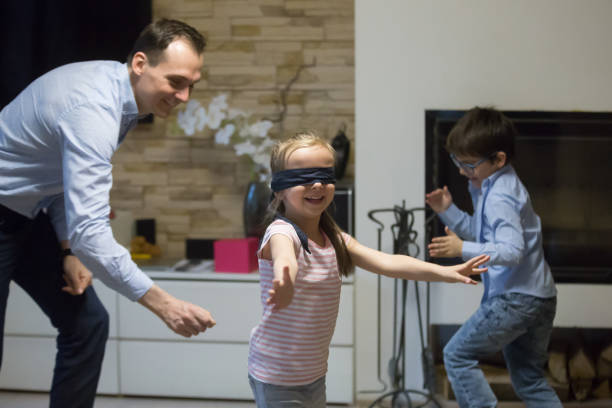 istock Single father with little kids playing hide and seek 1070079290