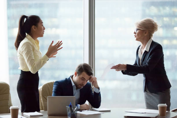 istock Female partners have disagreement over document at meeting 1070079838