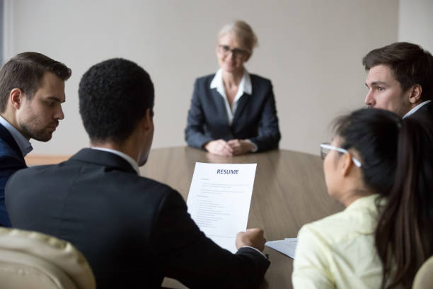 istock Back view of millennial employers consider candidate resume 1070080006