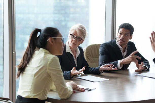 istock Employees dispute accusing colleague during company meeting 1070080022