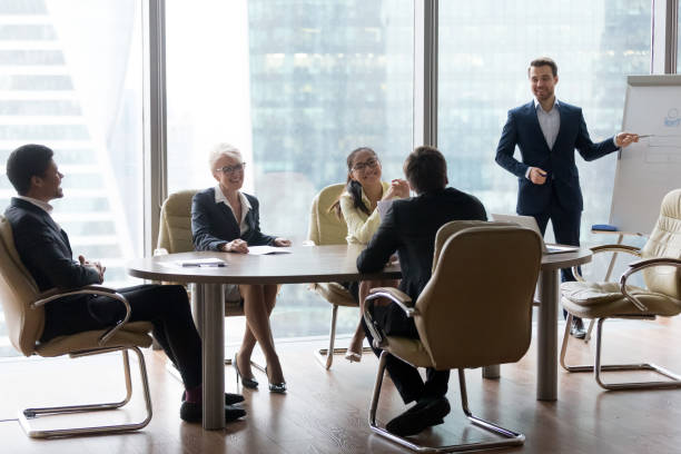 istock Male employee make presentation at friendly office meeting 1070080066