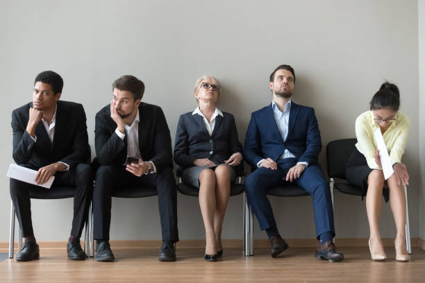 istock Multiethnic job candidates tired of waiting in queue for interview 1070080118