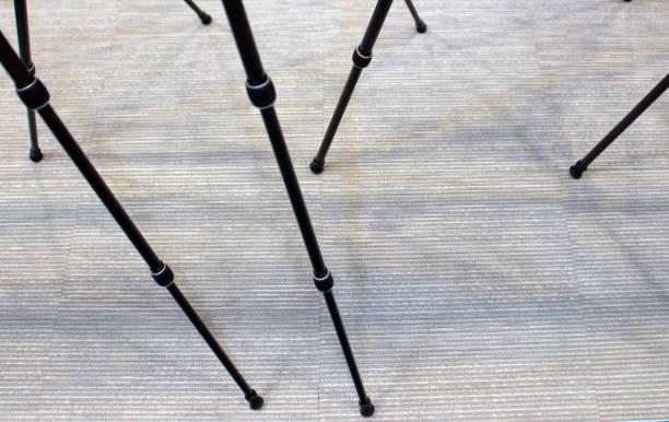 istock Several tripods with legs splayed out 1070081752