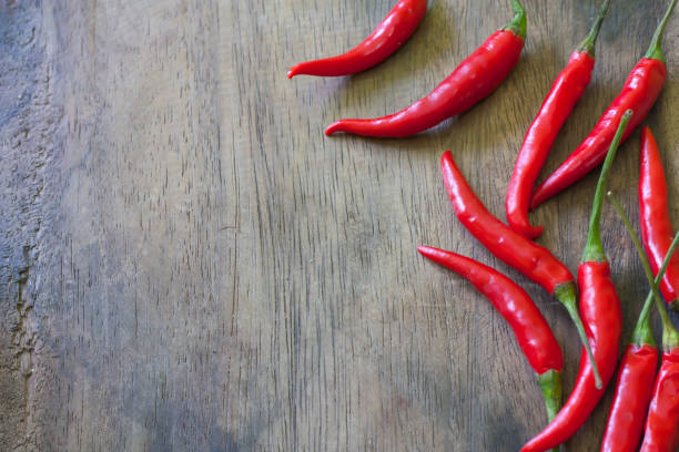 istock red chili on wood background 1070086068