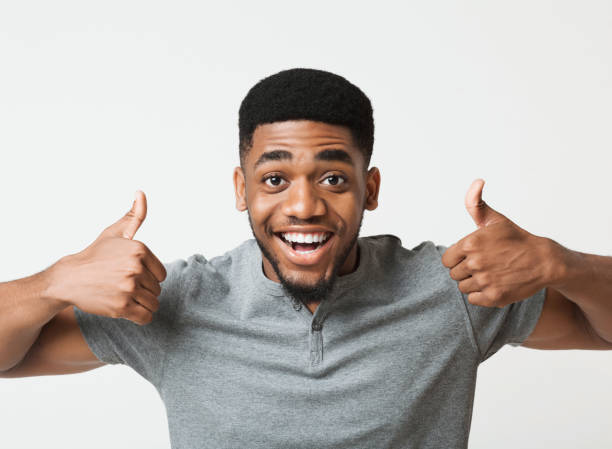 istock Happy black man showing thumbs up at studio 1070089026