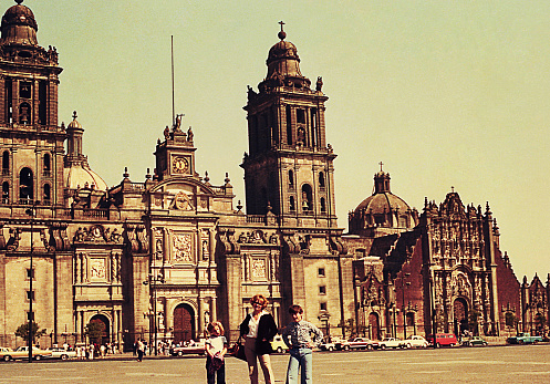 Vintage image of a mother and her children at the Zocalo Square in Mexico City.
