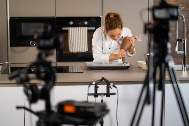 istock woman preparing cookies in tv set kitchen 1070097490