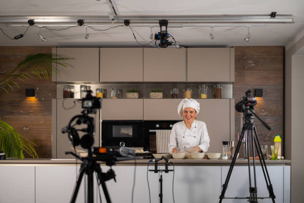 istock smiling female chef cook on film tv set studio kitchen 1070097734
