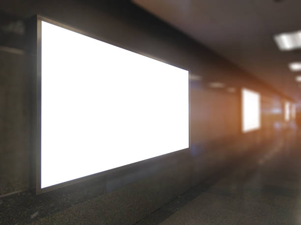 istock billboard big blank white LED screen perspective horizontal outstanding in subway side pathway people walking to train underground for display advertisement text template promotion new brand indoor. 1070097746