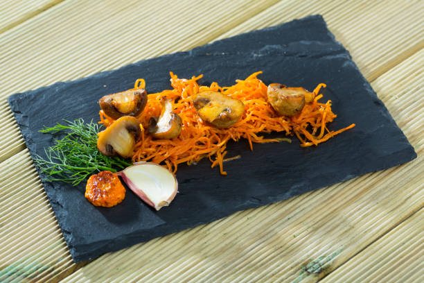 istock Roasted champignons with julienne carrots 1070100486