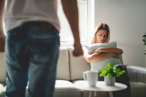 man beating up his wife illustrating domestic violence - violence domestic violence victim women imagens e fotografias de stock