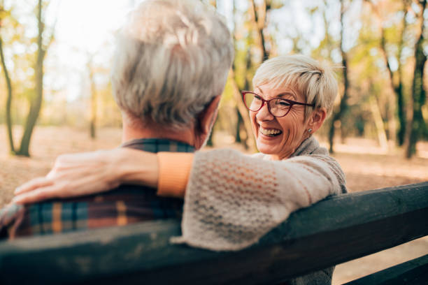istock Senior woman hugging her husband 1070110532