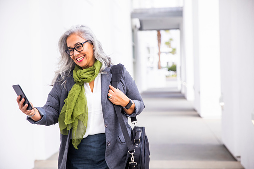 A senior hispanic businesswoman at the conference center