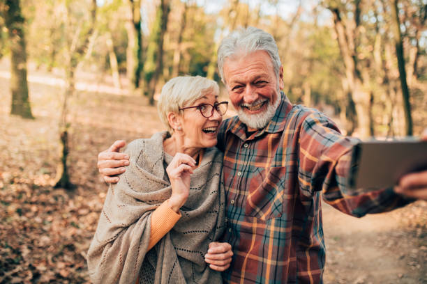istock Mature couple hugging when taking a selfie 1070115162
