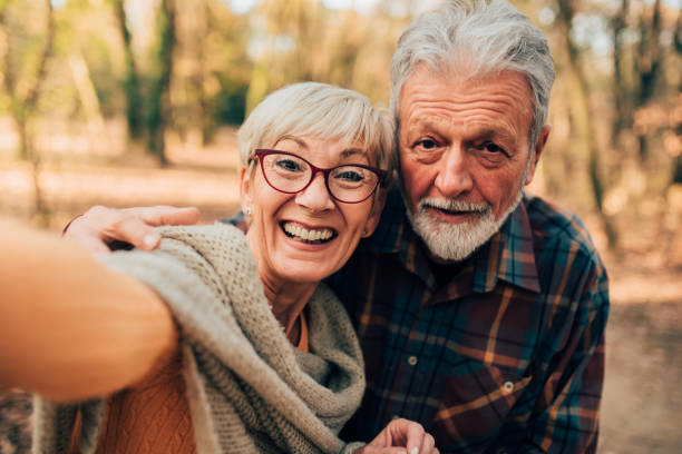 istock Happy woman taking a selfie with husband 1070115168