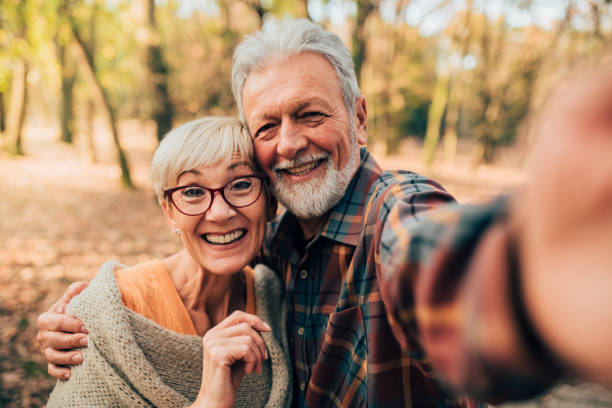 istock Happy mature couple taking a selfie 1070115240