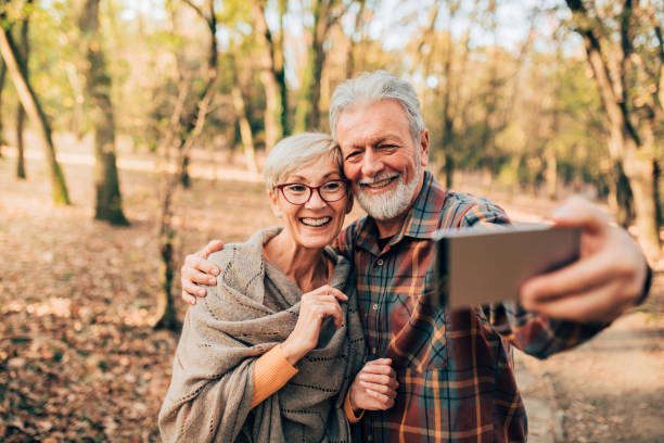 istock Senior couple using mobile phone 1070115362