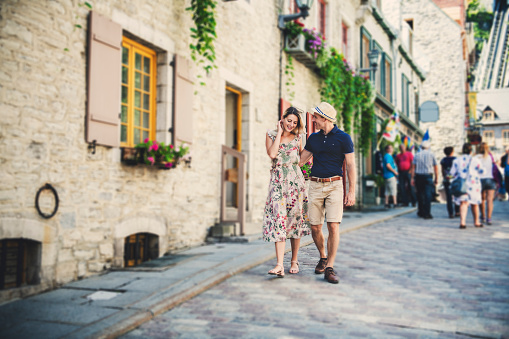 A Outdoor lifestyle portrait of young couple in love in old town
