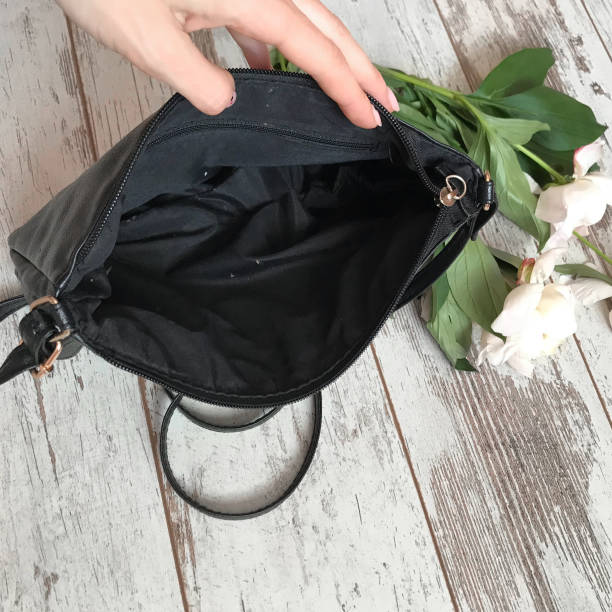 istock Black bag on a wooden background 1070118914