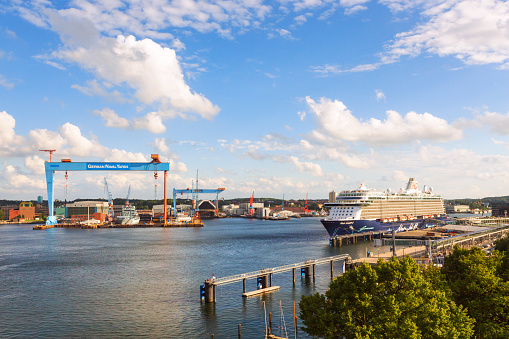Port of Kiel station for container ships and docked cruise ship