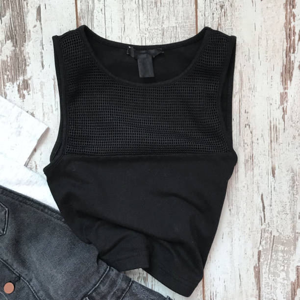 istock Black female top on a wooden background 1070120844