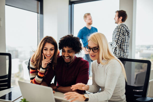 istock Young coworkers working on laptop 1070123240