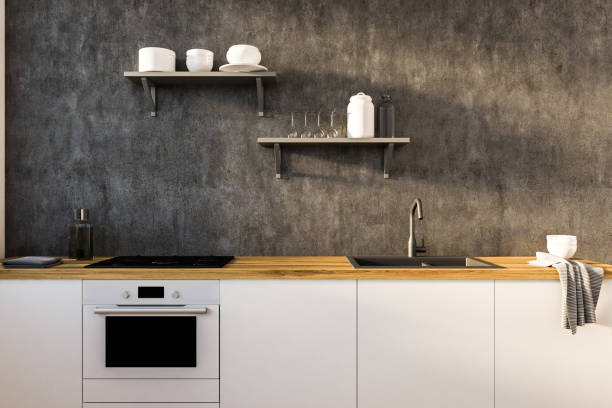 istock Concrete kitchen wall and white countertops 1070123858