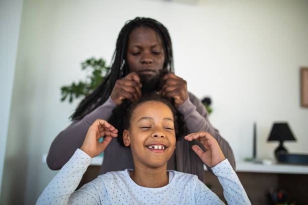 istock Mother styling daughters hair 1070125470