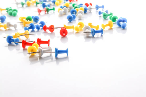 istock Colorful pushpins on white. Office supplies. 1070126512