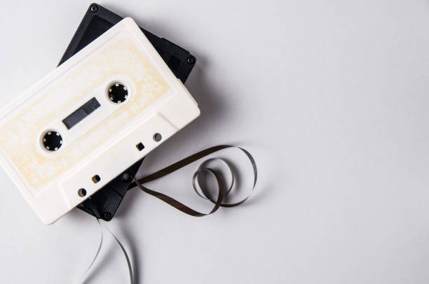 istock White and black audio cassettes on a light background. Place for text 1070127714